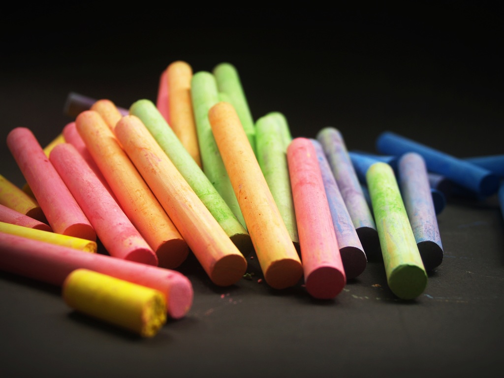 colorful chalk on a dark background