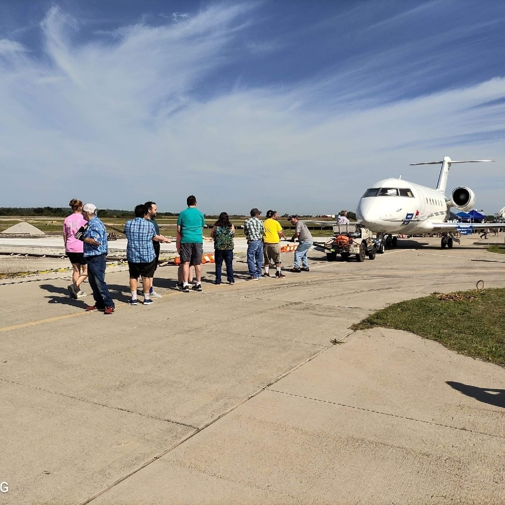 Burlington team pulling plane