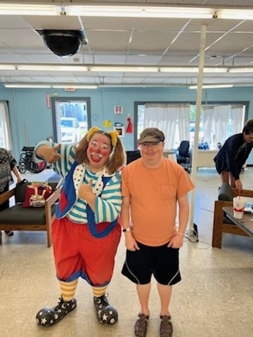 Zack striking a pose with circus clown