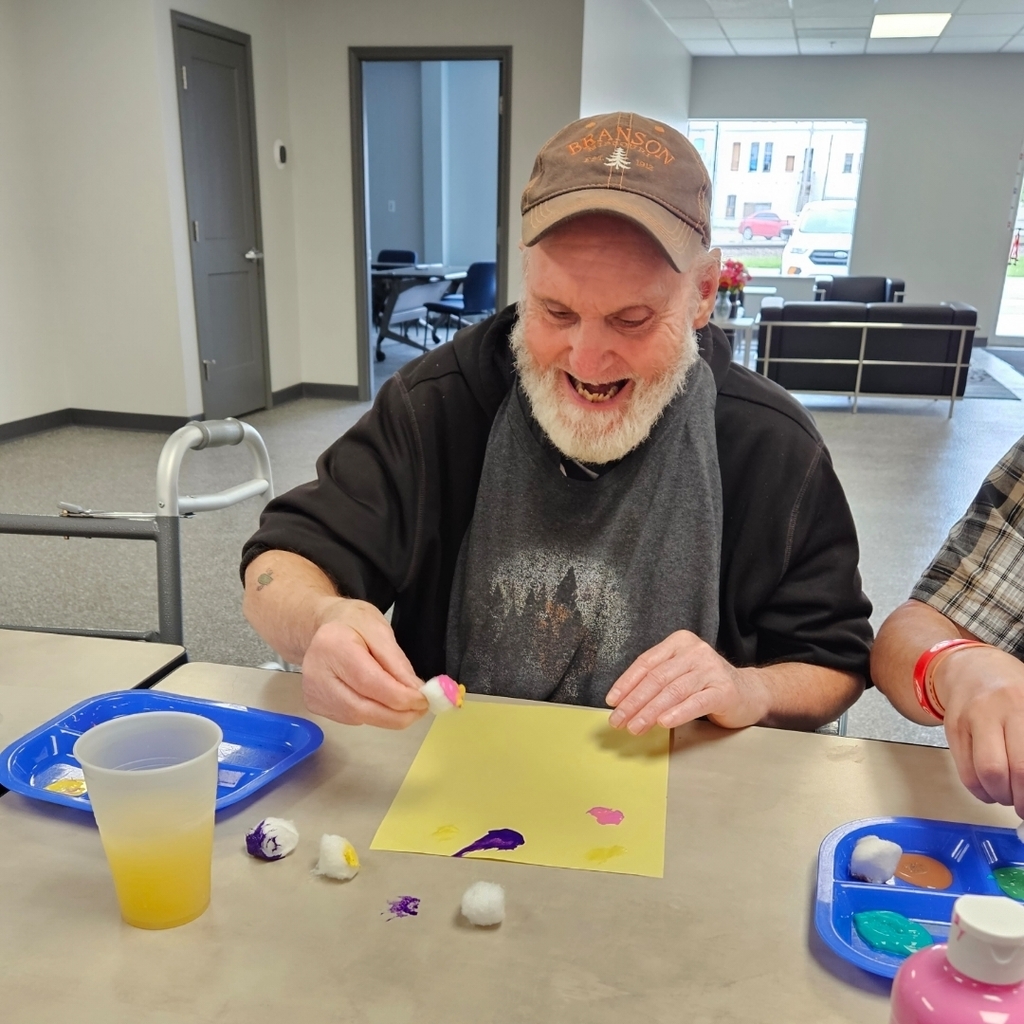 Trying cotton balls to dab our paint to make our creation!