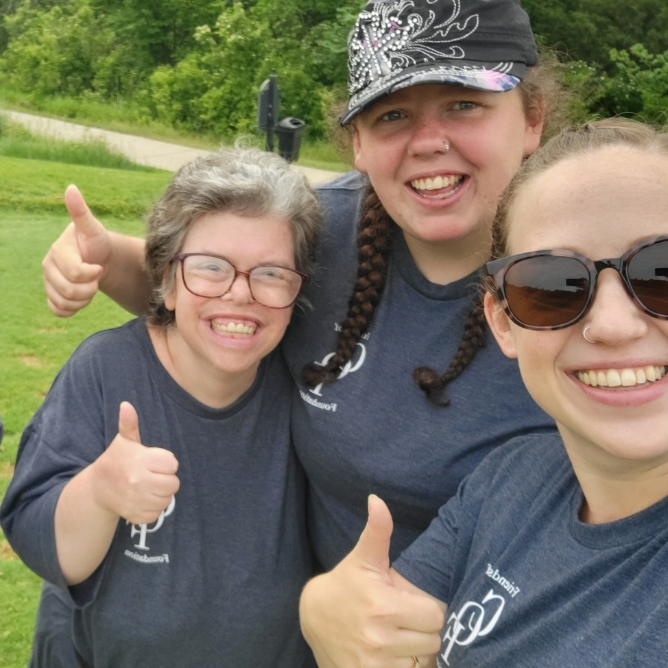 Thumbs up for good luck at the annual golf tournament 